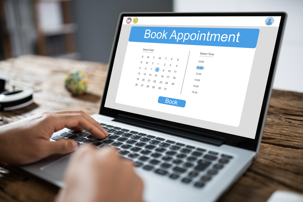 a laptop screen with book an appointment page